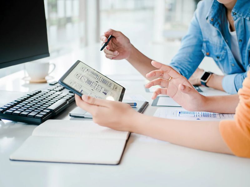 Two Women Review a Website Layout